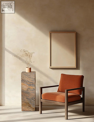 Orange upholstered armchair with dark wood frame next to solara plinth side table with brazilian quartzite stone top