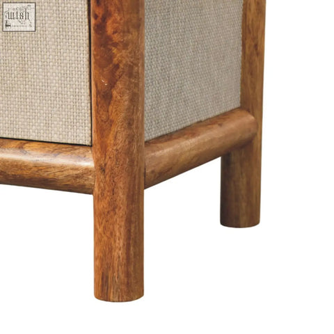 Solara rattan bedside table with warm polished wood frame and light beige woven fabric panels in mid-century style