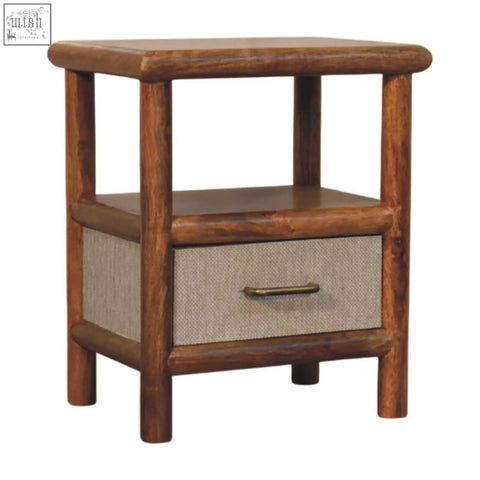 Rustic solara rattan bedside table with textured beige fabric drawer front and dark brown rounded wooden legs