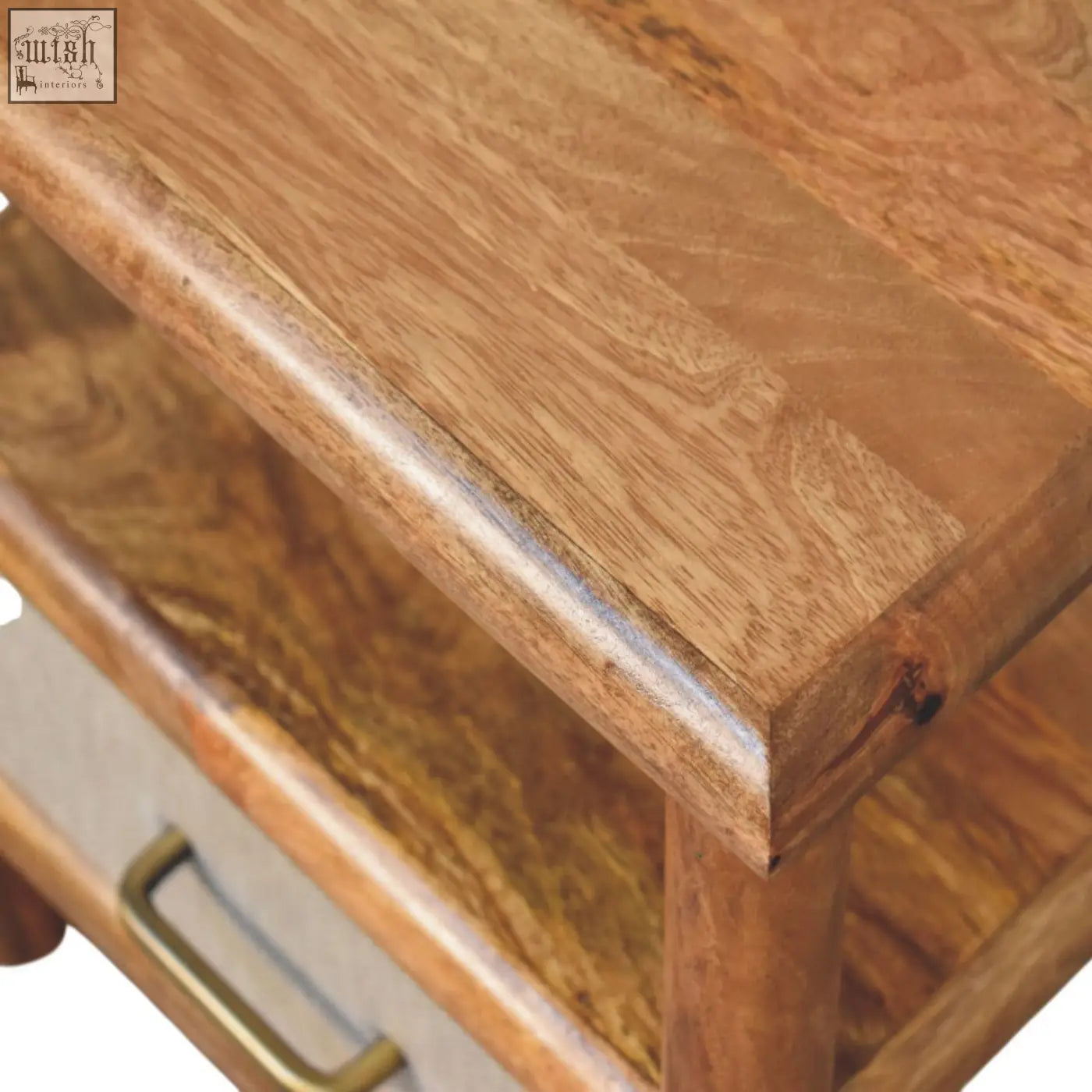 Solara rattan bedside table with rustic wooden top in warm natural finish and visible grain patterns