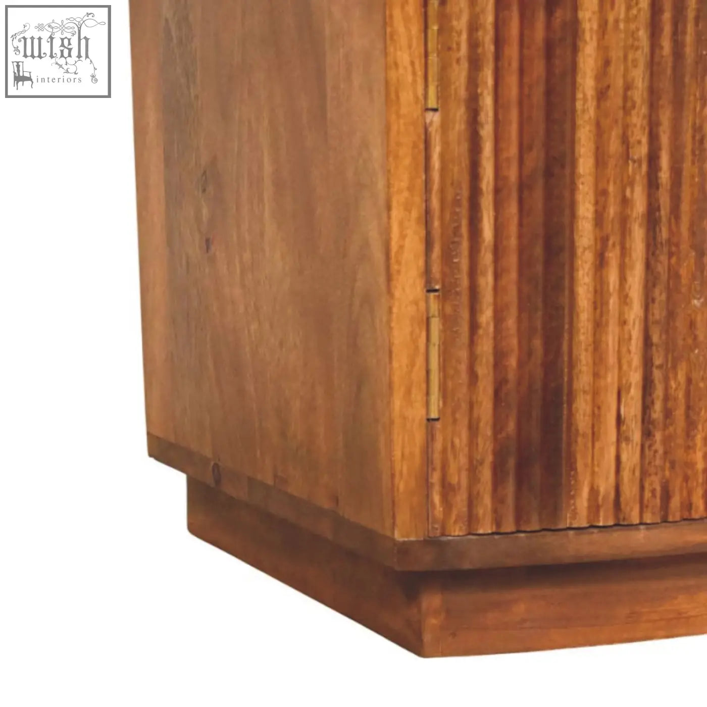 Solid wood curved bedside with warm-toned oak mango wood, vertical grooves, and brass hinges for stylish storage
