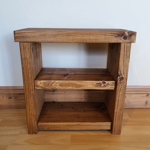 Solid wood rustic coffee table with two shelves and visible wood grain in warm brown finish
