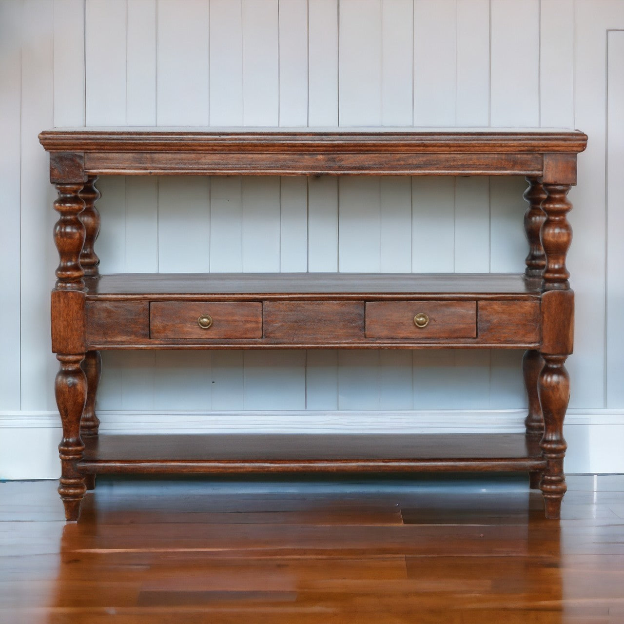 Antique-style solid wood console table with turned legs and two drawers in a warm brown finish