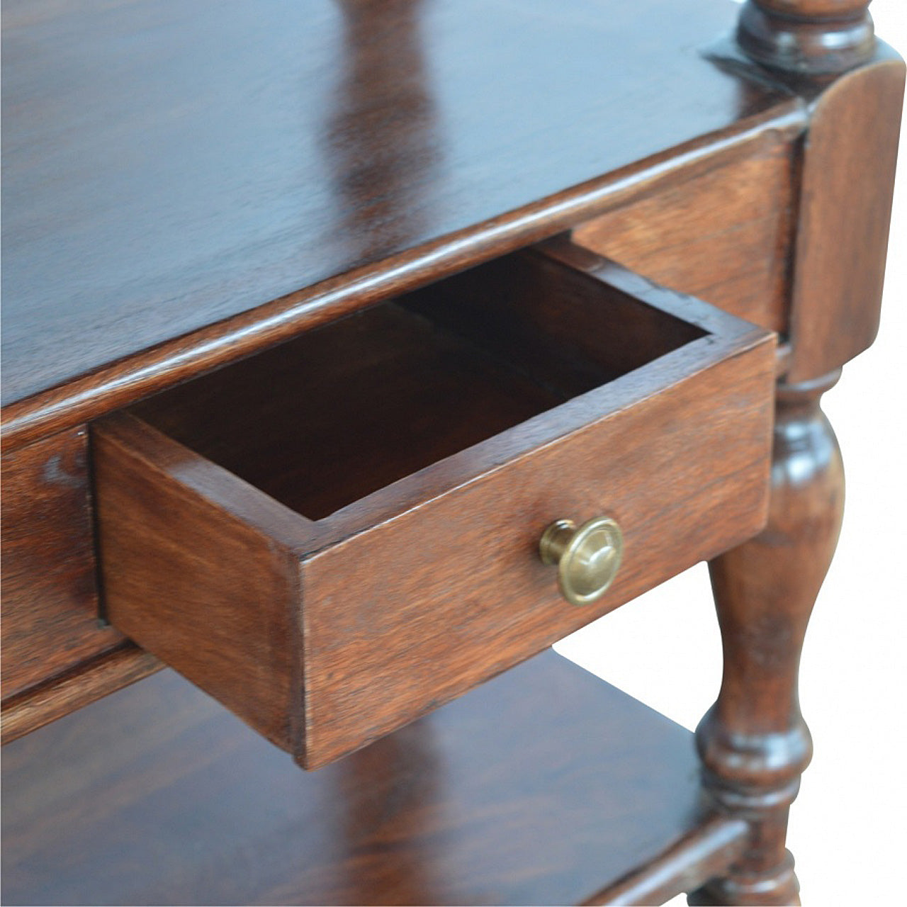 Dark brown solid wood side table with turned legs and a brass knob drawer pull for stylish storage