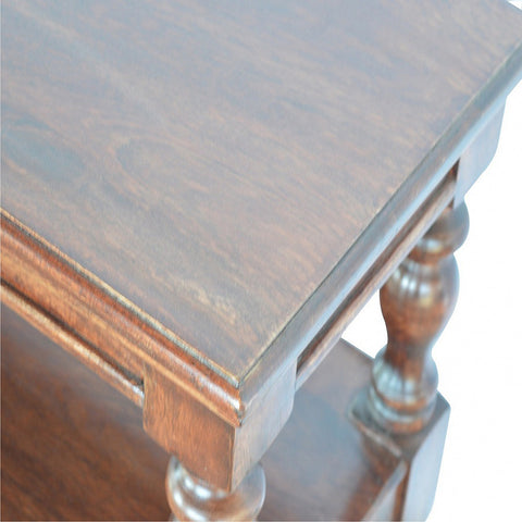 Dark brown solid wood console table with turned legs and smooth polished finish for stylish end table use