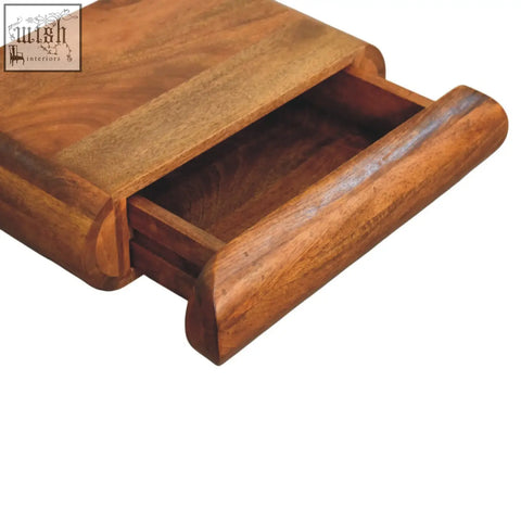 A solis wall mounted bedside table drawer made of warm natural mango wood with smooth finish and rounded edges