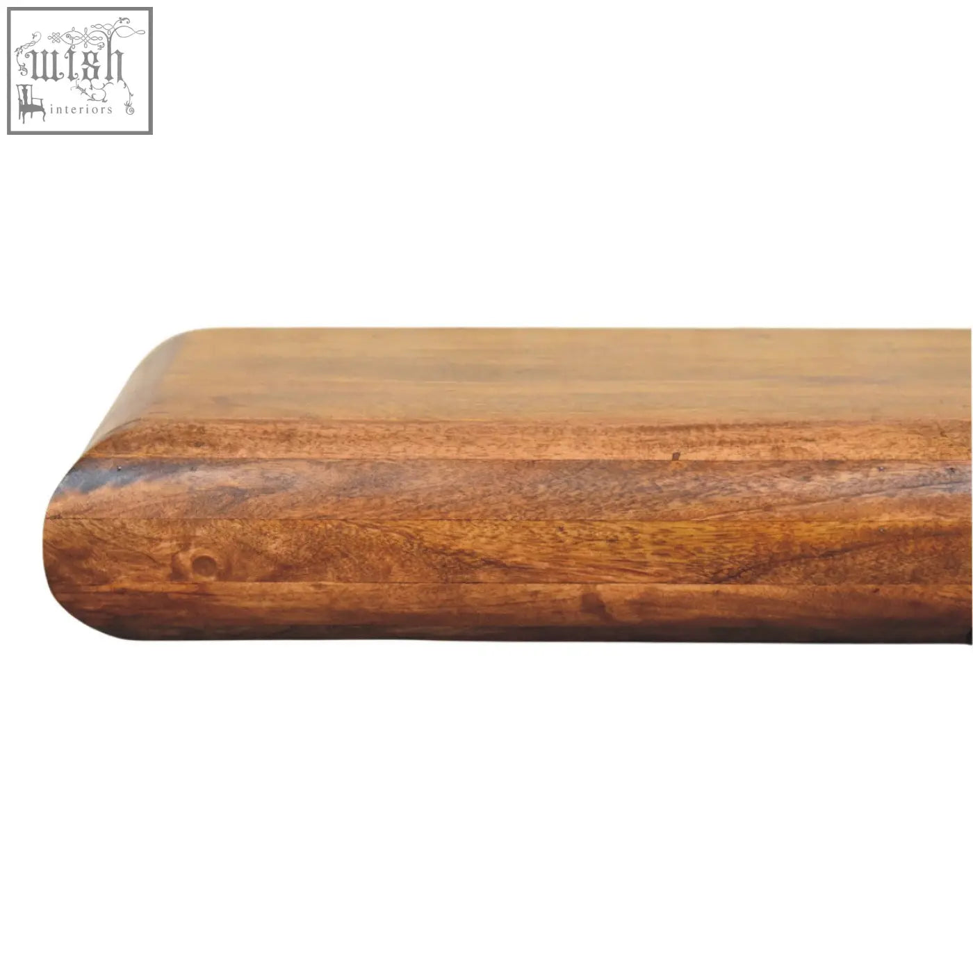Solis wall-mounted console chest of drawers with a smooth rounded mango wood cutting board in warm amber finish