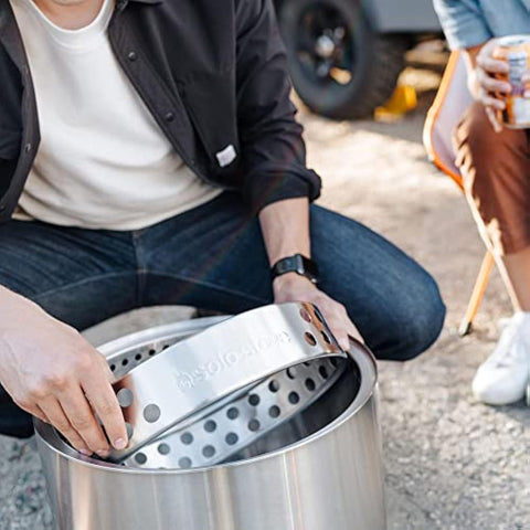 Stainless steel solo stove ranger fire pit insert with perforated design and engraved branding for camping stove use