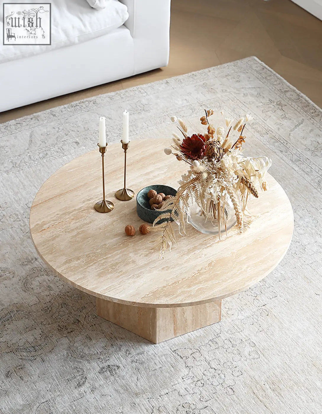 Beige stone solveig marble round coffee table with a smooth rounded top and hexagonal base ideal for living rooms