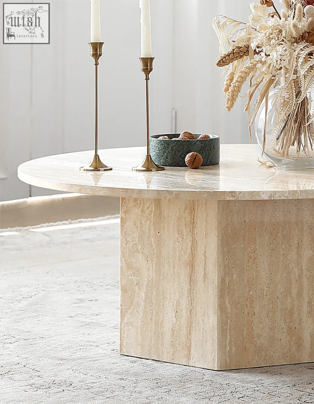 Beige stone coffee table with smooth polished surface and solid base perfect for the Solveig marble round style