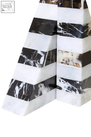 Soma set of two black and white striped marble bookends featuring white striped marble for stylish shelf support