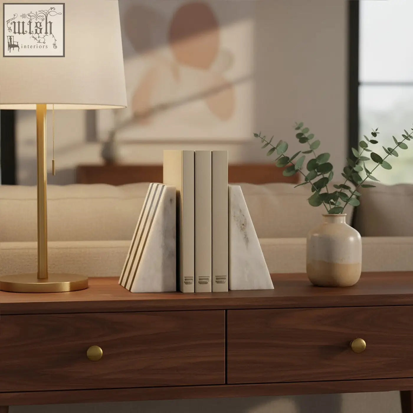 Cream-colored soma set of two white marble bookends with subtle veining and sleek modern design perfect for shelves
