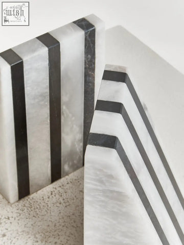 Soma set of two striped white marble bookends with sleek rectangular design and alternating white and dark gray marble bands