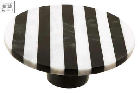 Black and white striped marble knob on soma small white marble round cake stand with sleek circular design