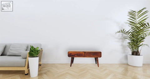 A minimalist wooden sonata chestnut coffee table with two drawers and tapered legs in a warm medium-brown stain