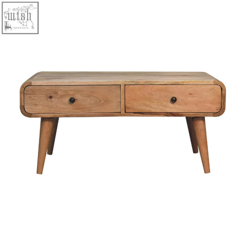 A light wood sonata oak-ish coffee table with oak-like finish rounded edges two drawers and tapered legs