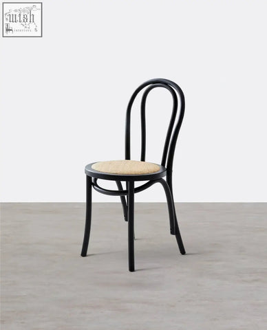 Black solid wood sonnet dining chair with bentwood frame and woven natural fiber seat perfect for dining use