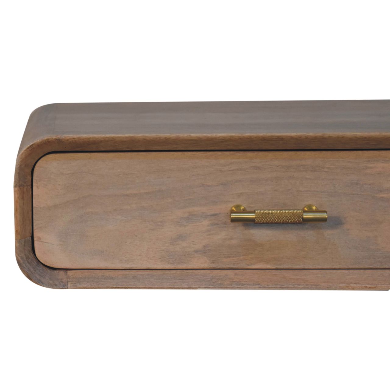 A sleek light brown wooden drawer with a brushed brass textured handle in a wall mounted bedside table