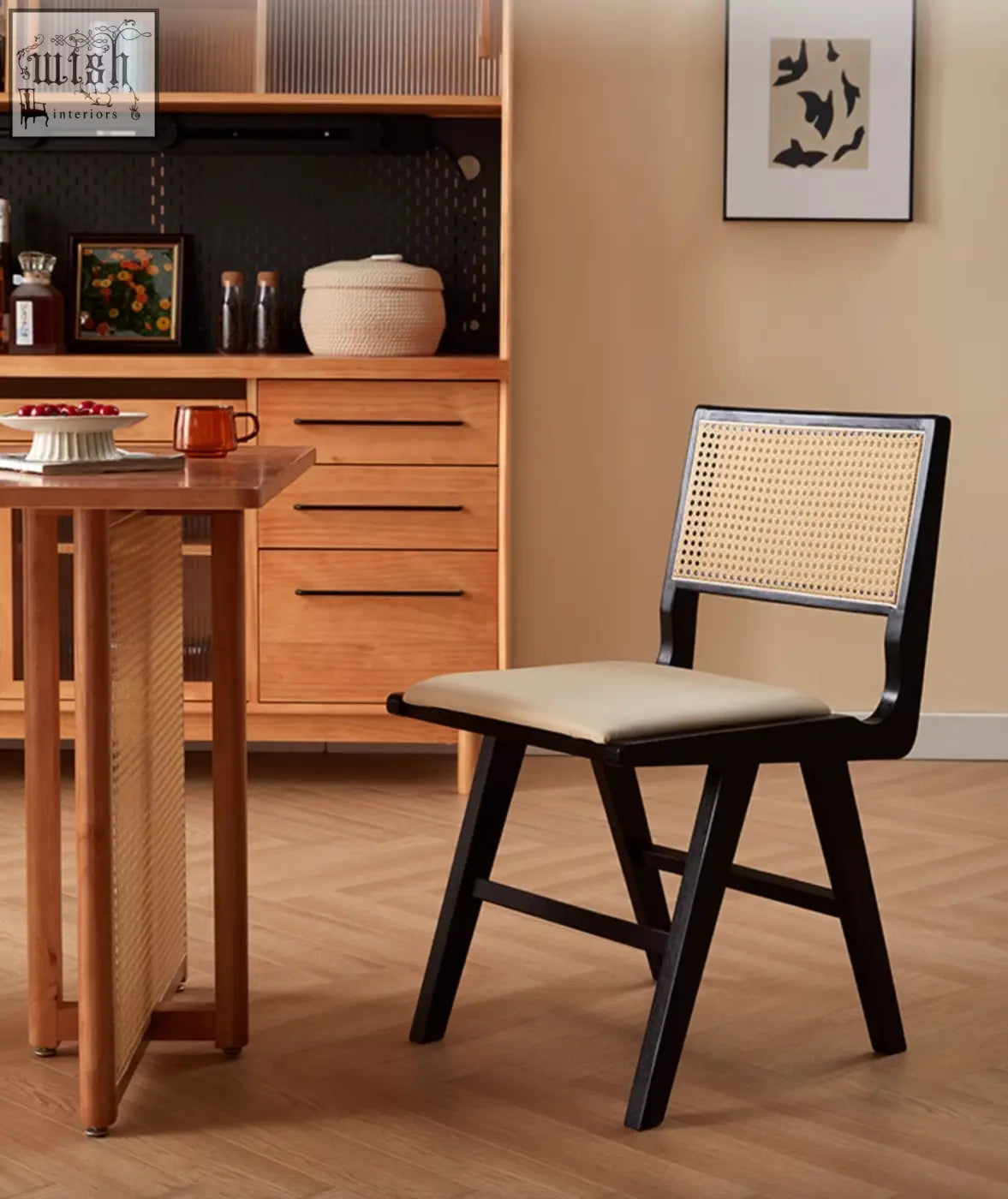 Black-framed cane-back sophia rattan dining chair with beige upholstered seat perfect for dining rooms