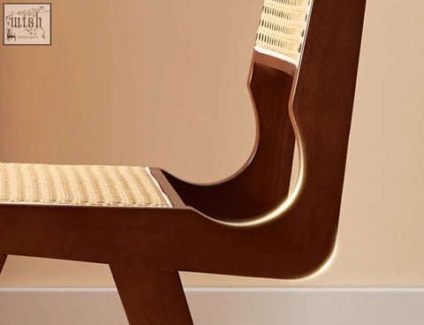 A sleek dark wood framed sophia rattan dining chair with a woven cane seat and backrest perfect as a dining chair