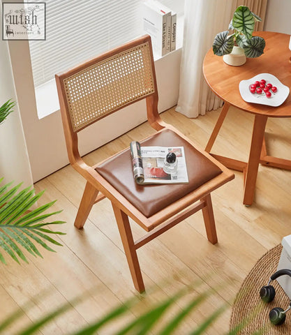 Wooden sophia rattan dining chair with woven cane back and brown leather seat perfect as a dining chair