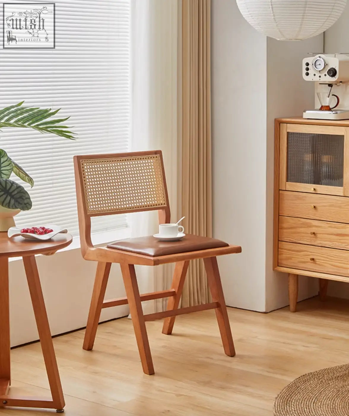 Wooden sophia rattan dining chair with woven cane back and brown leather seat perfect for dining room use