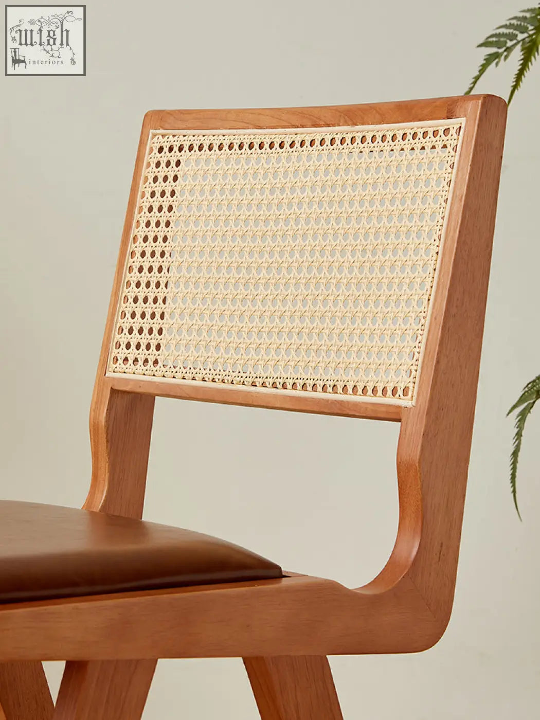 Wooden sophia rattan dining chair with woven cane back and brown leather seat perfect as a rattan dining chair