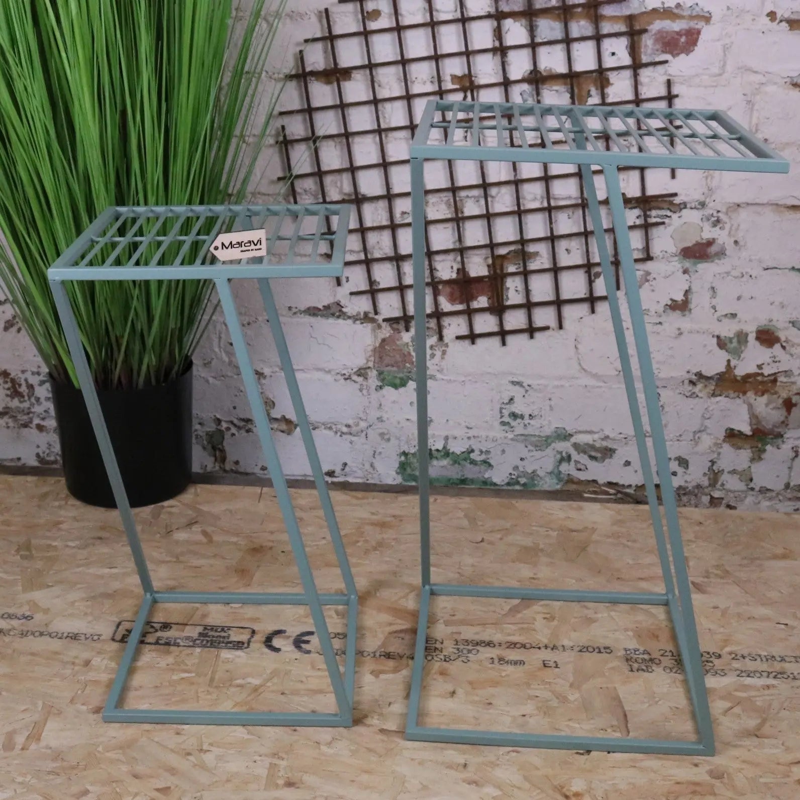 Two light blue metal plant stands with grid design perfect for a green garden table set like soraya green garden