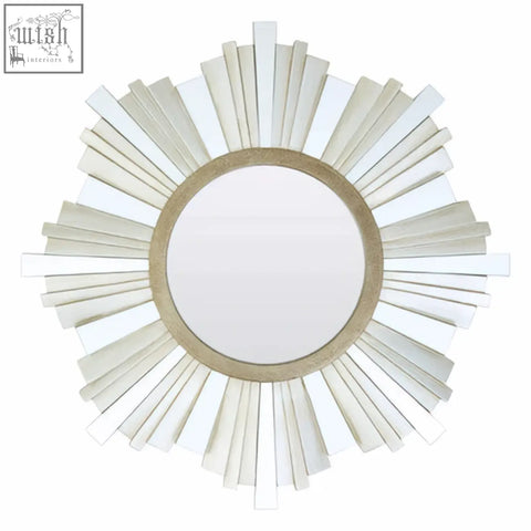 Sorrel wall mirror with a sunburst design featuring white glass panels and a light beige wooden frame