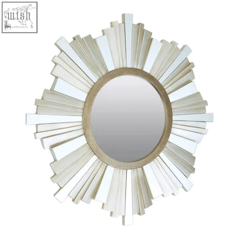 Sorrel wall mirror with a distressed white and beige sunburst frame featuring an oval reflective surface and rectangular slats