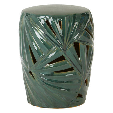 A glossy sorrell green ceramic garden stool with intricate palm leaf cutouts perfect as a green ceramic table
