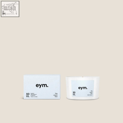 White ceramic soul mini candle with light blue label and eym branding shown next to matching box