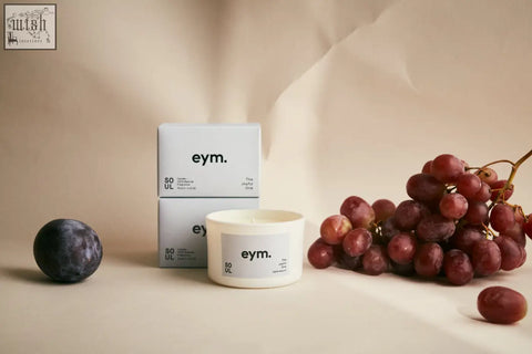 White cylindrical mini candle with minimalist label and eym branding from the soul collection