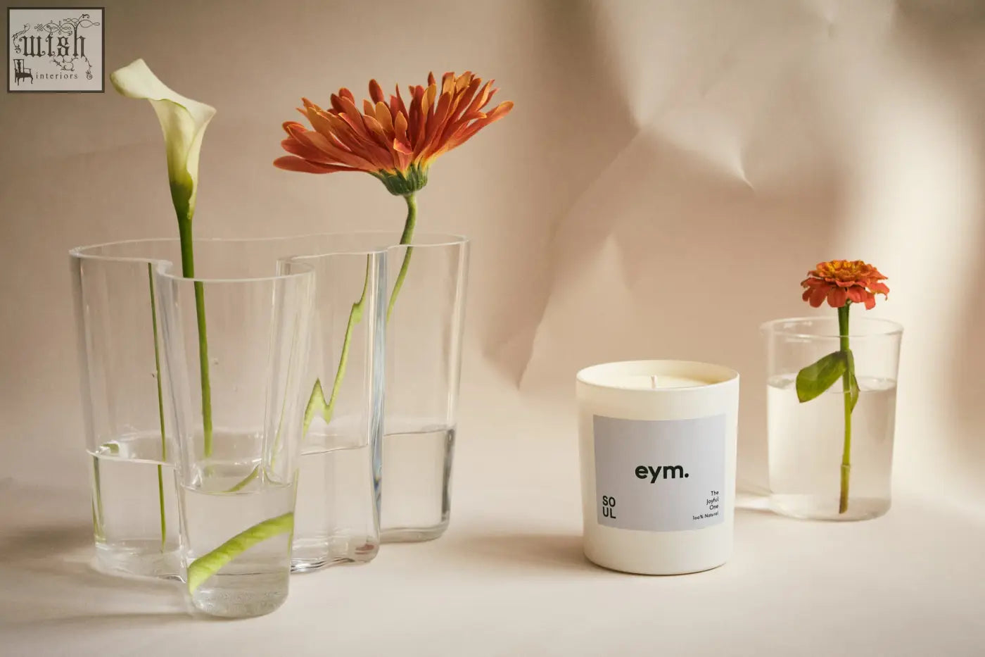 White cylindrical standard candle with minimalist gray eym soul label in a clean white container