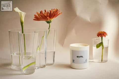 White cylindrical standard candle with minimalist gray eym soul label in a clean white container