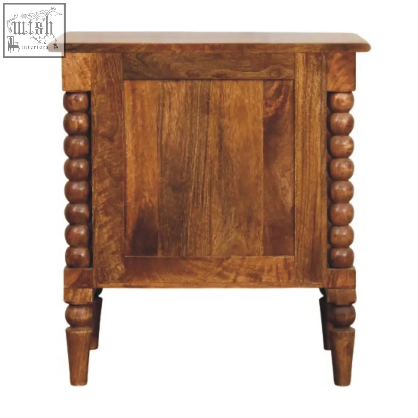 A rustic amber oak bedside table with turned spindle legs and decorative bead columns on its sides