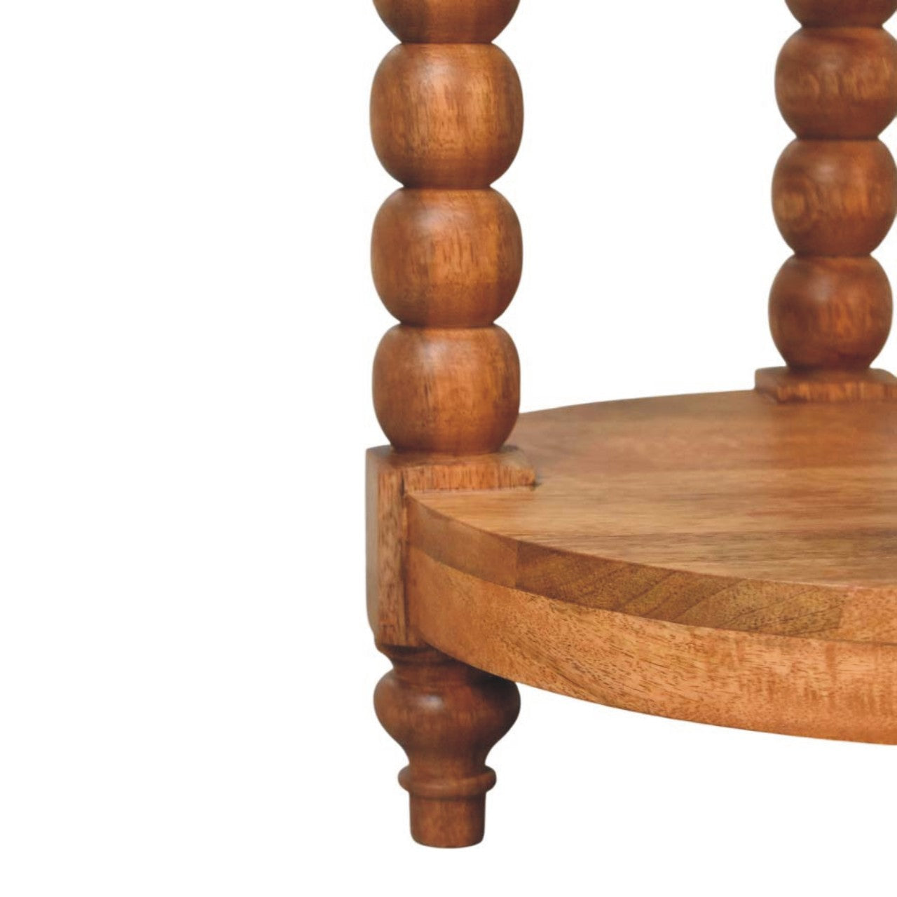 Light brown spindle round side table with turned spindles and a lower shelf in golden teak finish