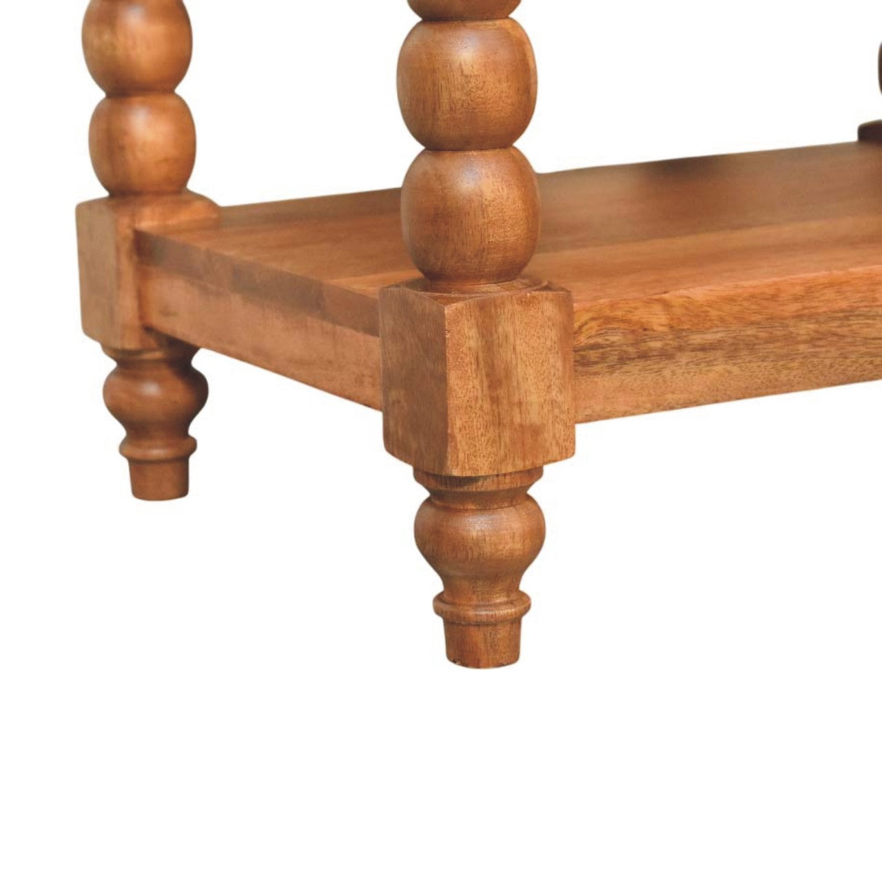 Light brown spindle side table with turned legs and visible wood grain finish in golden teak finish with two open shelves