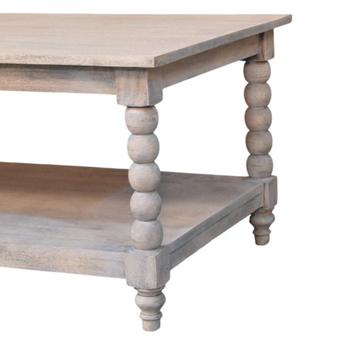A rustic spindle washed coffee table with turned spindle legs and a weathered gray finish on natural wood top
