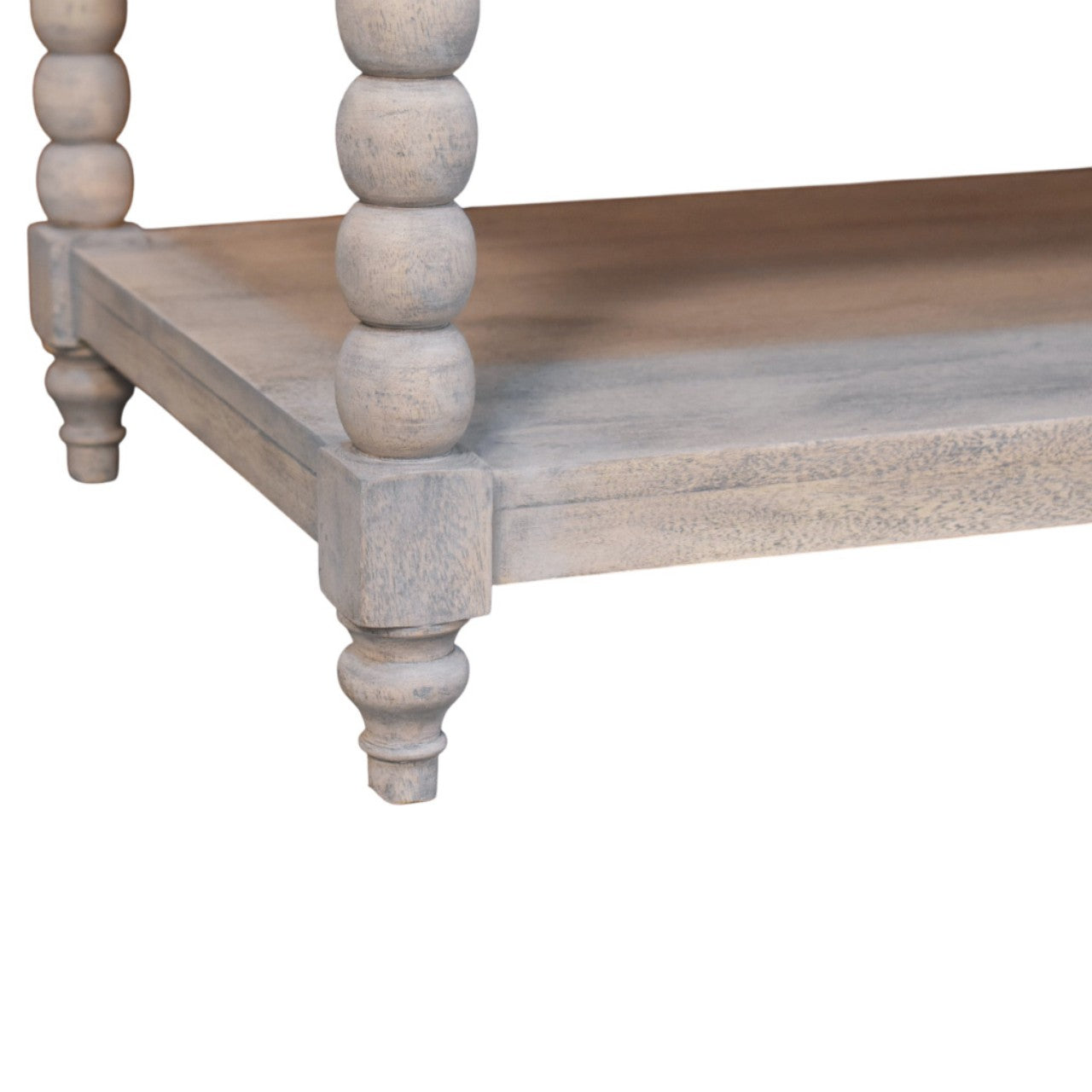 A rustic spindle washed coffee table with weathered gray finish and turned spindle bead legs