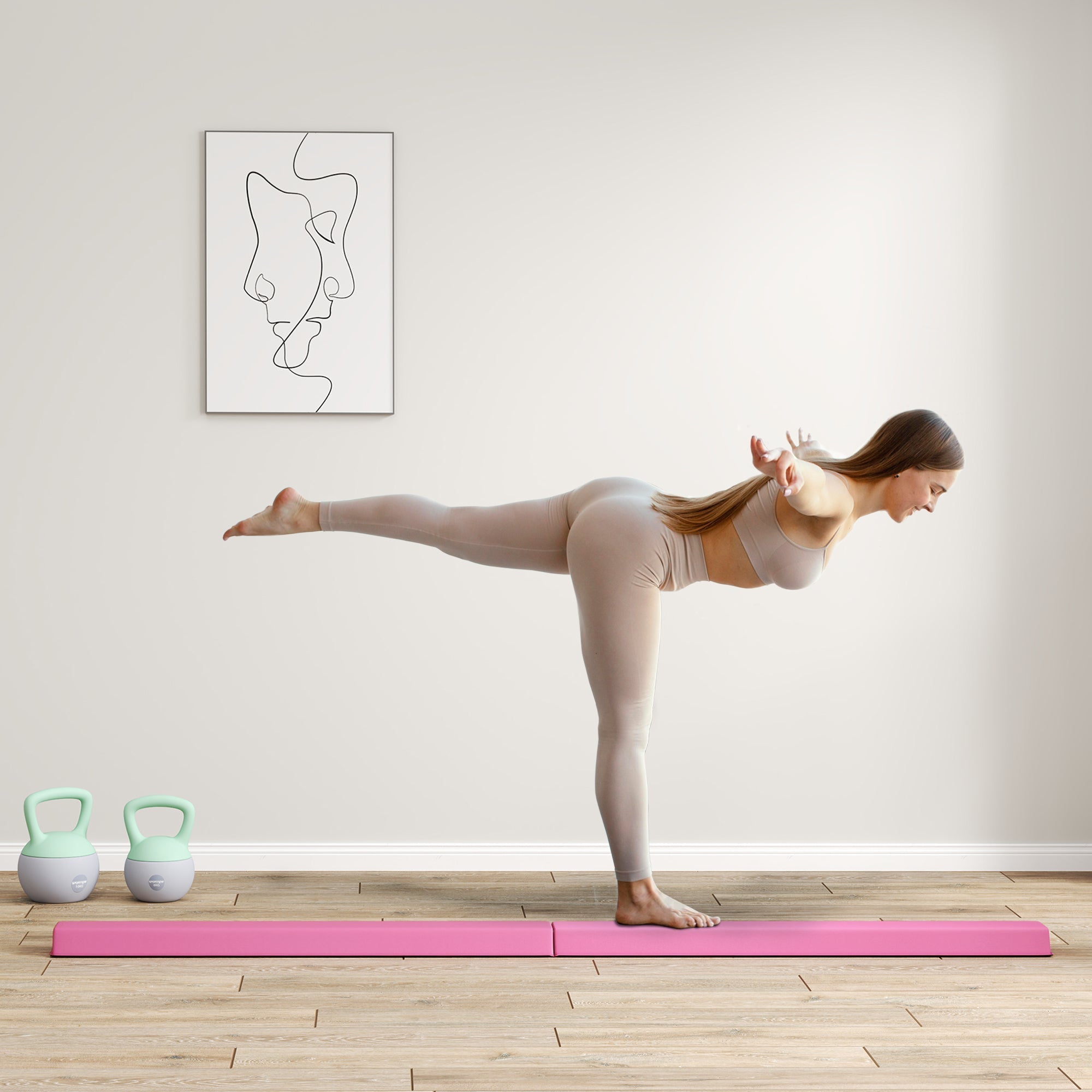 A woman on a vibrant pink foam mat practices yoga next to a pink sportnow folding balance beam with eva foam core