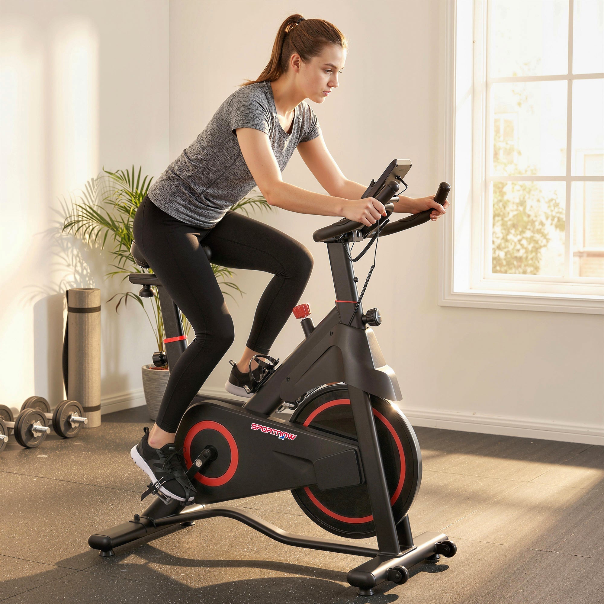 Sportnow exercise bike in black and red with adjustable magnetic resistance and tablet holder for indoor cycling