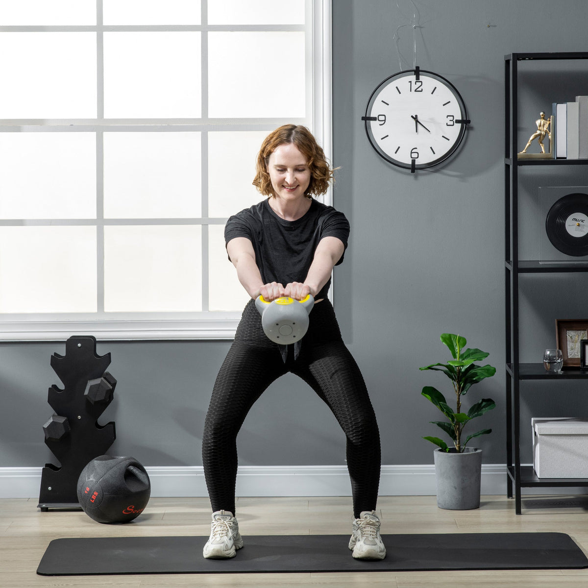 Gray sportnow kettlebell with yellow handle for strength training and home gym weight lifting 4kg kettle bell