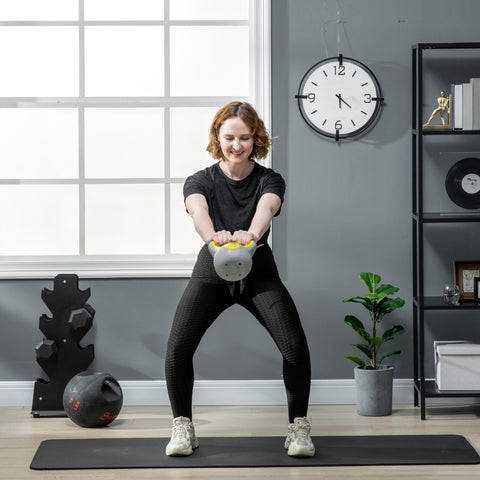 Gray sportnow kettlebell with yellow handle for strength training and home gym weight lifting 4kg kettle bell