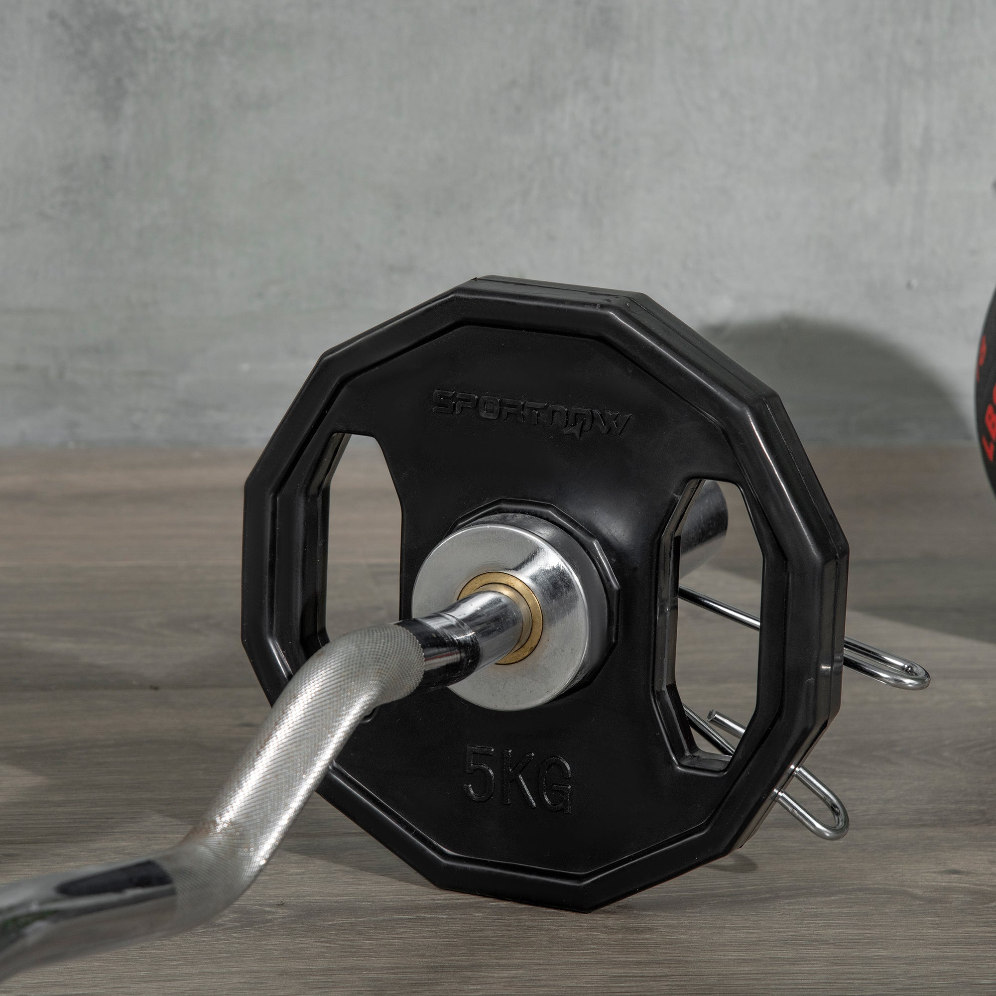 Black sportiq 5kg weight plate with robust steel central hole for home gym strength training and lifting
