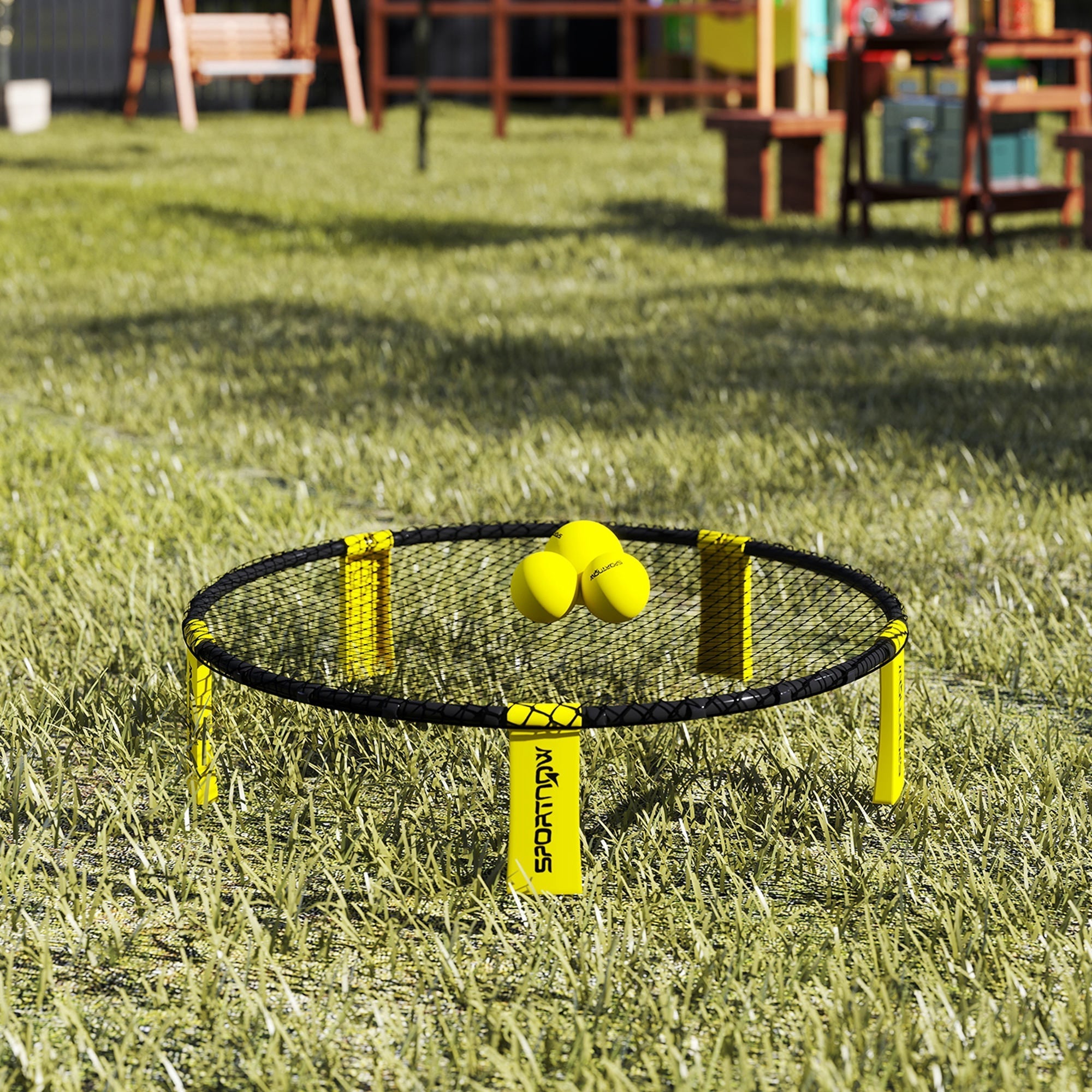 Yellow and black sportnow spike ball set with foldable legs and three bright yellow balls on outdoor net target
