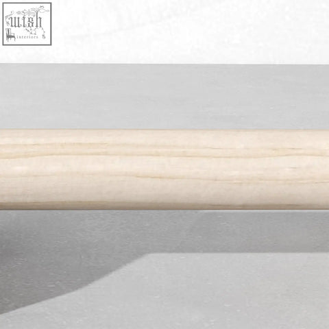 Light-colored sportnow wooden parallettes bar with visible grain patterns for home gym calisthenics training
