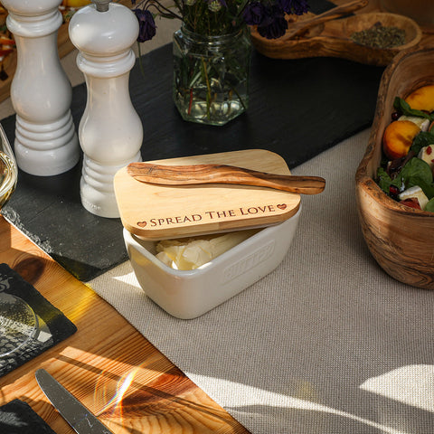 White ceramic butter dish with natural wood lid engraved spread the love and matching olive wood spreader