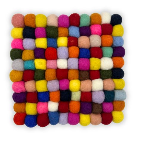 A vibrant square felt ball placemat made of multicolored wool balls arranged in a neat grid pattern
