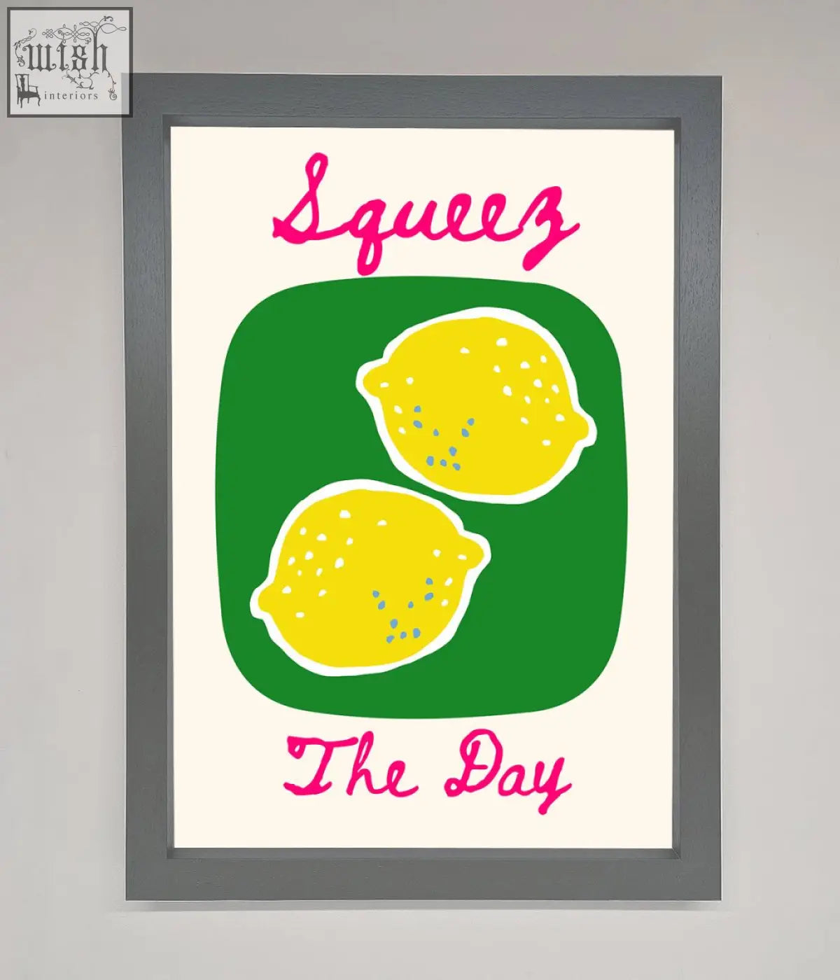 A day framed poster with two yellow lemons on green and pink squeeze the day text in playful script style
